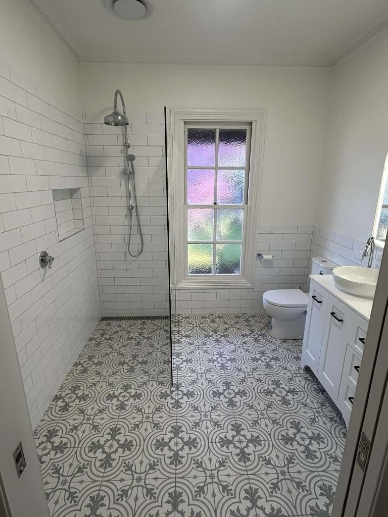 Walk-in shower, subway tiles and original window