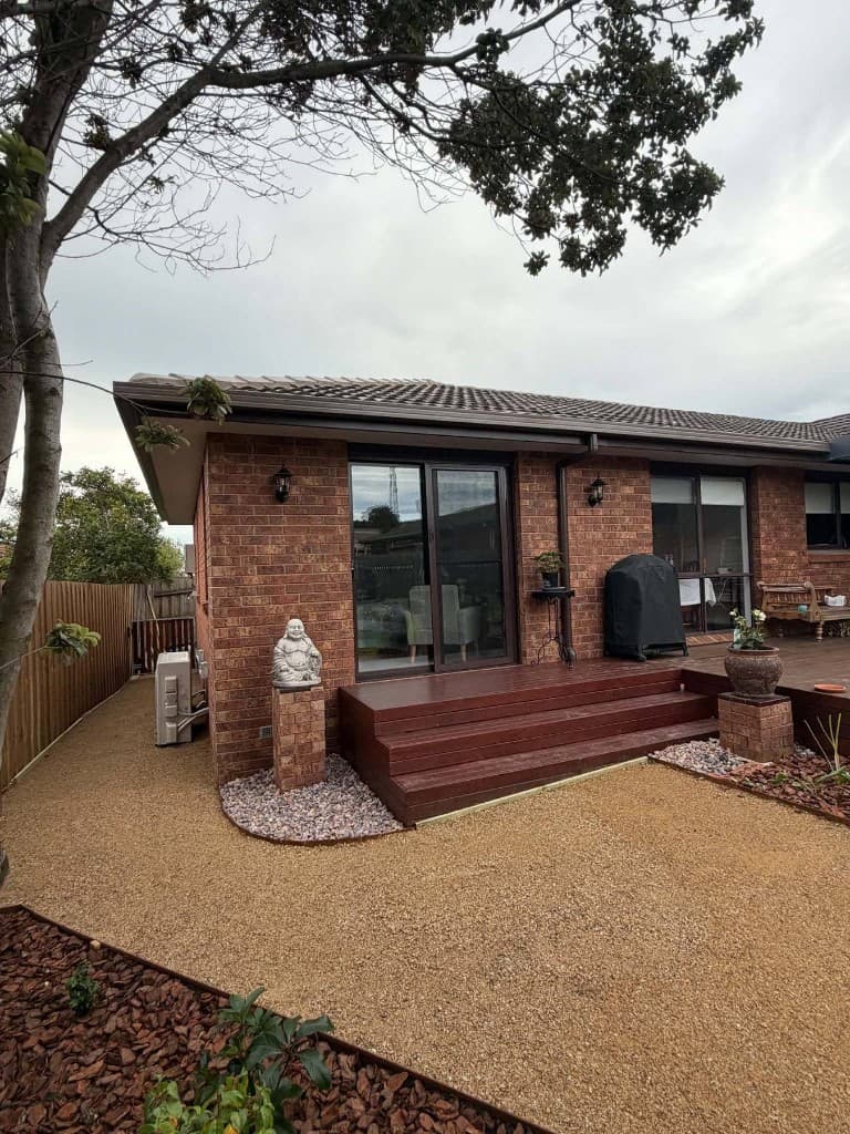 Brick home with rear deck and garden