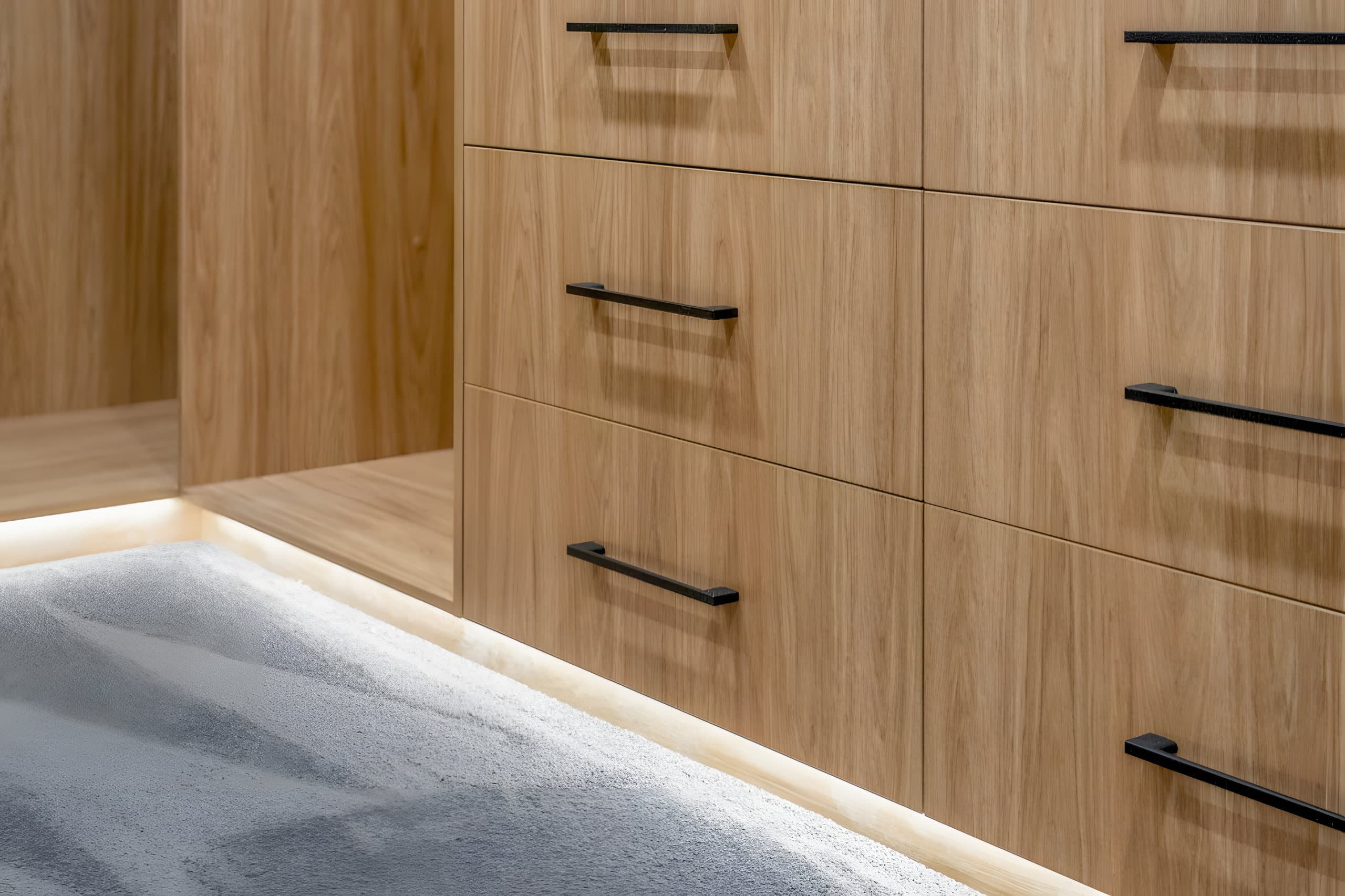 Drawer detail with black handles and underlighting