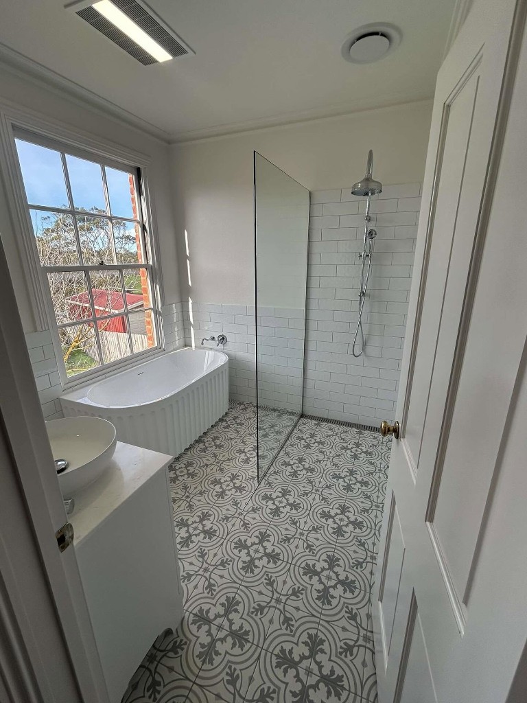 Bathroom with freestanding bath and walk-in shower