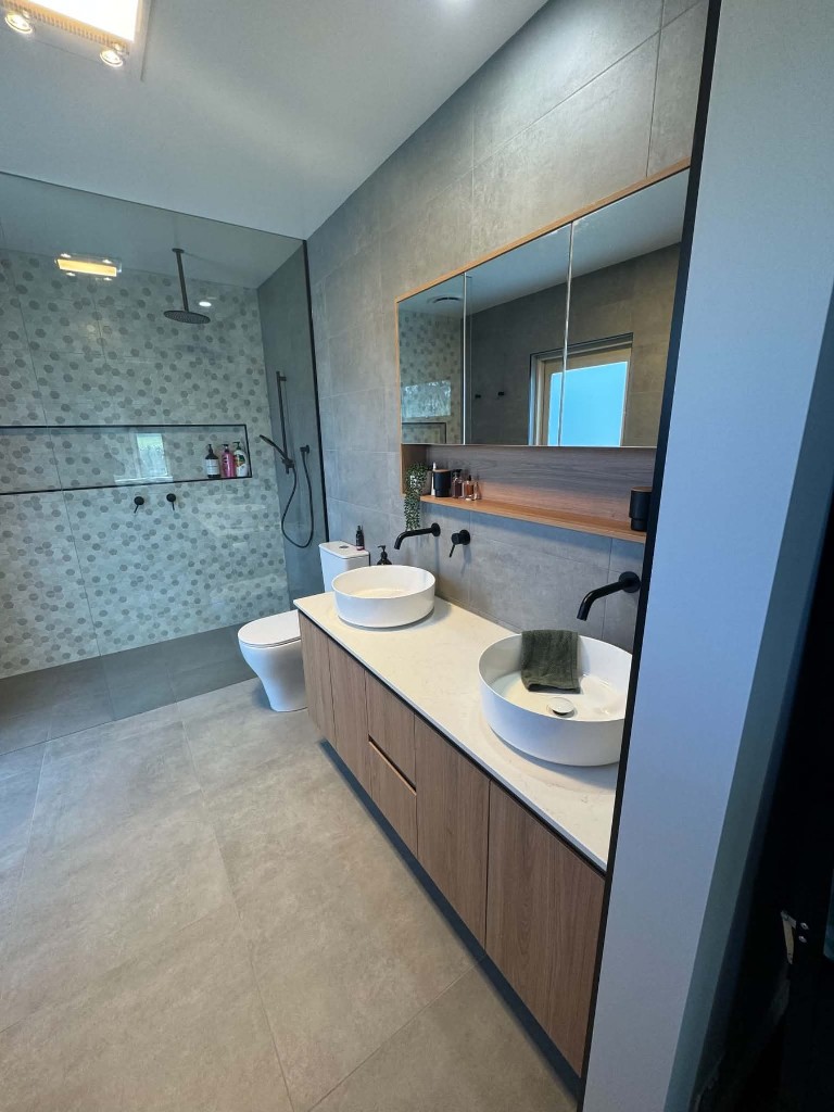 Ensuite with timber vanity and glass shower