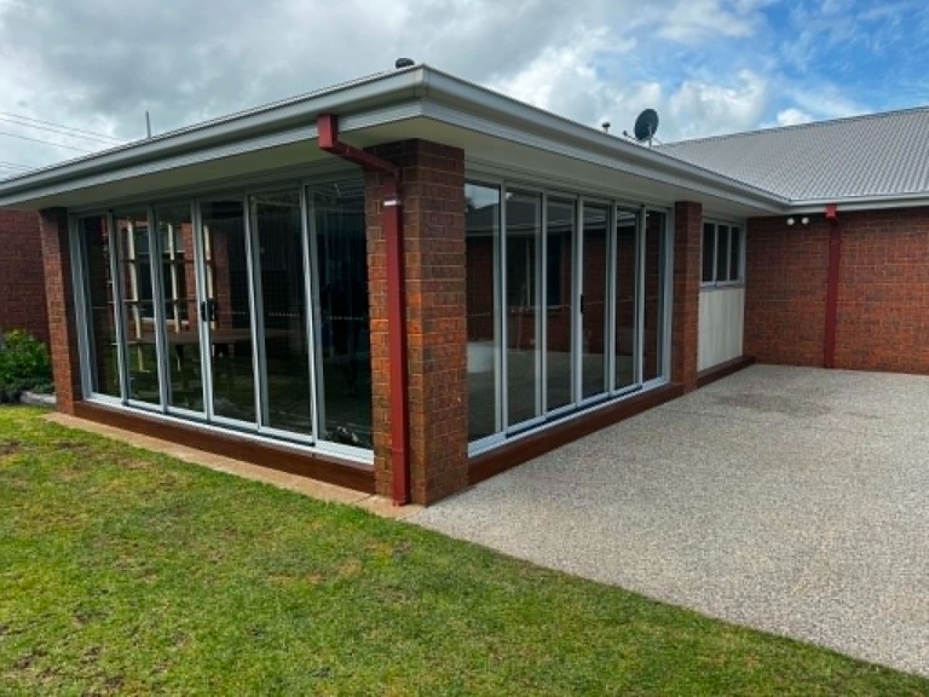 Glass and brick sunroom extension